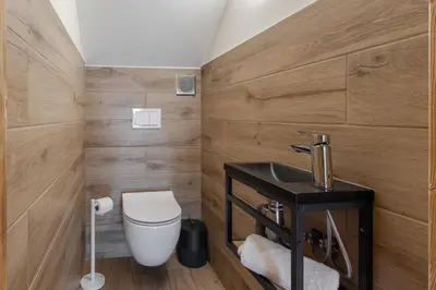 a bathroom with a toilet and a sink at Chalet La Source - Ideal familles ski et rando in Chamonix-Mont-Blanc