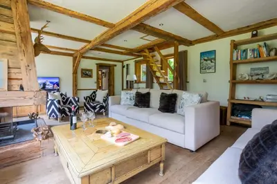 a living room with a couch and a coffee table at Chalet Martinique - Chamonix All Year in Chamonix-Mont-Blanc