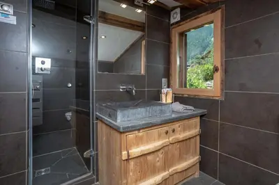 a bathroom with a sink and a shower at Chalet Martinique - Chamonix All Year in Chamonix-Mont-Blanc