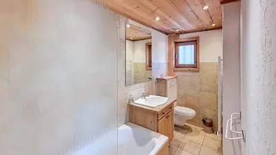 a bathroom with a sink and a toilet at 1 Peupliers - CENTRE du VILLAGE - in Megève