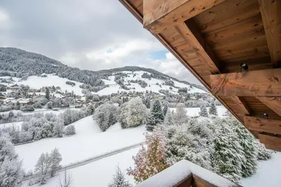 an aerial view of a town in the snow at Luxury Chalet Black Mountain - 4BR, Sleeps 10, Fireplace, Mountain Views & Garden - Megève in Megève