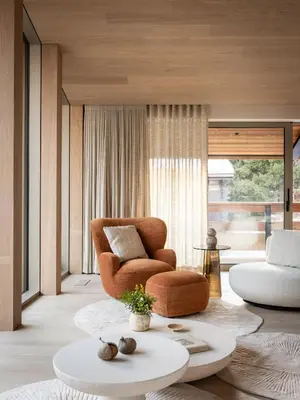 a living room with a chair and a table at Chalet Acorn in Chamonix-Mont-Blanc