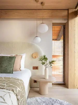 a bedroom with a bed and a table at Chalet Acorn in Chamonix-Mont-Blanc