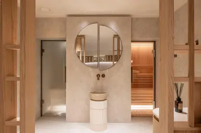 a bathroom with a sink and a mirror at Chalet Acorn in Chamonix-Mont-Blanc