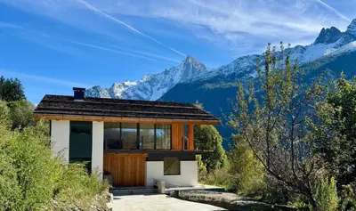 a house with a view of the mountains at Chalet Acorn in Chamonix-Mont-Blanc