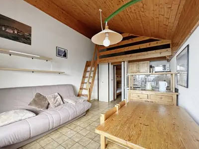 a living room with a couch and a table at BA332 Appartement 4 6 Pers Pied de pistes Carroz in Les Carroz d'Araches