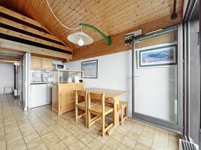 a kitchen with a wooden table in a room at BA332 Appartement 4 6 Pers Pied de pistes Carroz in Les Carroz d'Araches