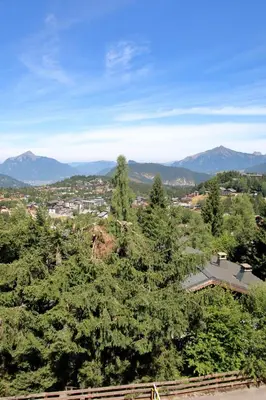 a view of a city with trees and mountains at BA332 Appartement 4 6 Pers Pied de pistes Carroz in Les Carroz d'Araches