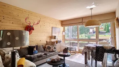 a living room with a couch and a table at 1 RR6169 - Rochebrune- proche pistes in Megève
