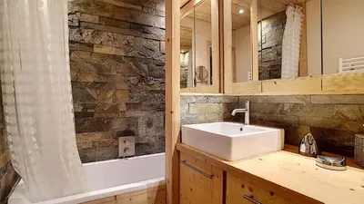 a bathroom with a sink and a mirror at 1 RR6169 - Rochebrune- proche pistes in Megève