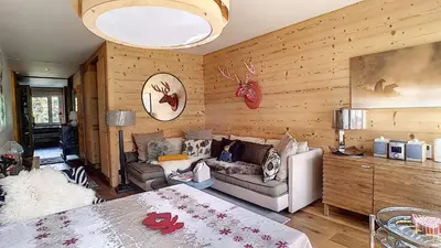 a living room with a couch and a table at 1 RR6169 - Rochebrune- proche pistes in Megève