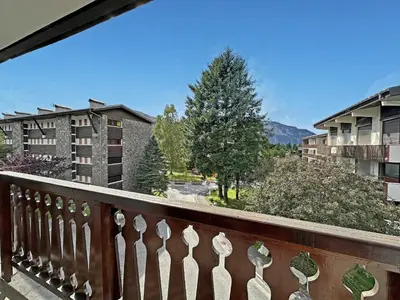 a balcony with a view of a city at MAR219 - Appartement 4 5 pers centre village in Les Carroz d'Araches