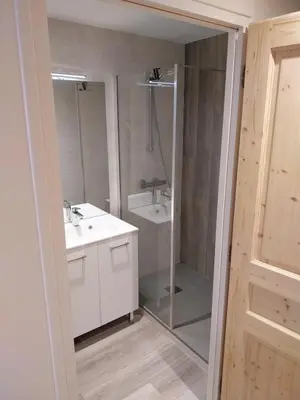 a bathroom with a shower and a sink at La Ferme De Réjane in Saint-Gervais-les-Bains