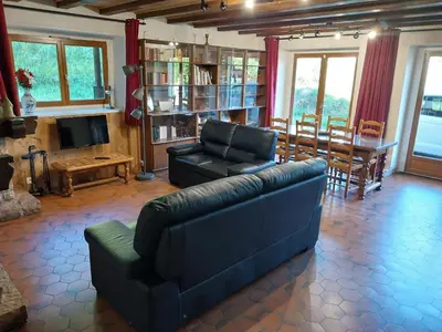 a living room with a couch and a table at La Ferme De Réjane in Saint-Gervais-les-Bains