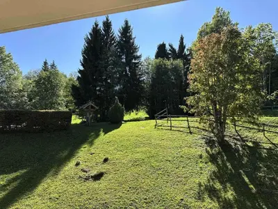 a large yard with a fence and a tree at Résidence Ecrin Des Glacier Aiglon - Ecrin des glaciers Aiglon 14 MAE-2783 in Combloux