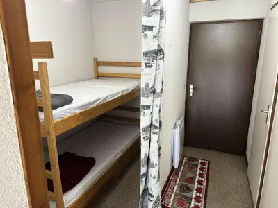 a small room with two bunk beds and a door at Résidence Ecrin Des Glacier Aiglon - Ecrin des glaciers Aiglon 14 MAE-2783 in Combloux