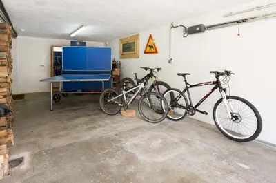 two bikes parked against a wall in a garage at Chalet Couttet - Chamonix All Year in Chamonix-Mont-Blanc