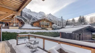 a balcony of a log cabin in the snow at Chalet Deutz in Chamonix-Mont-Blanc