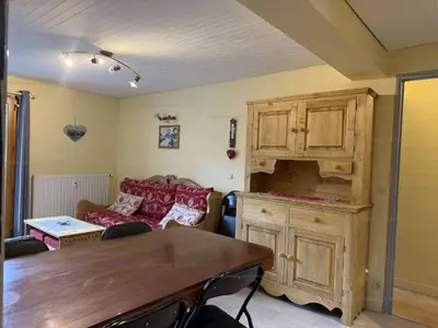 a living room with a couch and a table at Appartement aux Carroz d'Arâches, 4 pers, 39 m² - FR-1-572-327 in Arâches-la-Frasse