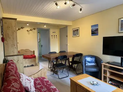 a living room with a table and a couch at Appartement aux Carroz d'Arâches, 4 pers, 39 m² - FR-1-572-327 in Arâches-la-Frasse