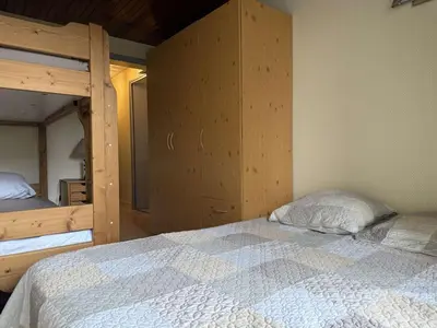 a bedroom with two bunk beds and a bed with a pillow at Appartement aux Carroz d'Arâches, 4 pers, 39 m² - FR-1-572-327 in Arâches-la-Frasse