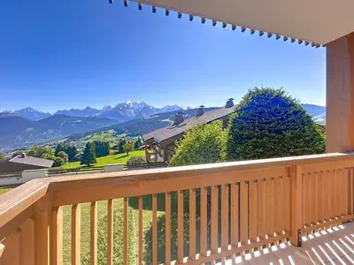 a balcony with a view of the mountains at Appartement 2 chambres, vue Mont Blanc, parking inclus - FR-1-560-168 in Combloux