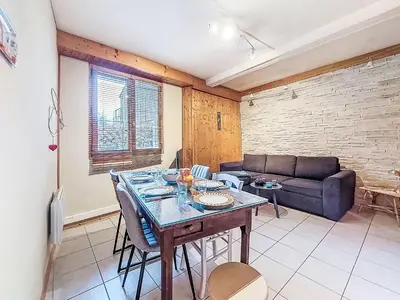 a living room with a couch and a table at Apartment Au Bon Coin by Interhome in Saint-Gervais-les-Bains
