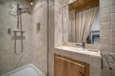 a bathroom with a shower and a sink and a tub at Appartements dans le Chalet Nessa - Combloux in Combloux