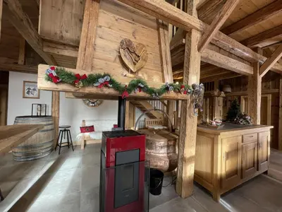 a living room with a fireplace with christmas decorations at Chalet spacieux à Samoëns, 6 chambres, idéal pour 14 personnes avec Wifi - FR-1-846-1 in Samoëns