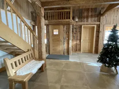 a living room with a staircase and a christmas tree at Chalet spacieux à Samoëns, 6 chambres, idéal pour 14 personnes avec Wifi - FR-1-846-1 in Samoëns