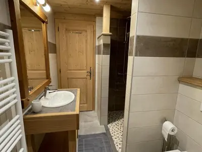 a bathroom with a sink and a shower at Chalet spacieux à Samoëns, 6 chambres, idéal pour 14 personnes avec Wifi - FR-1-846-1 in Samoëns