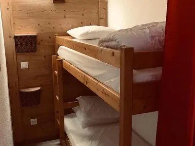 a couple of bunk beds in a room at Studio cosy pour 4 à Samoëns - FR-1-846-4 in Samoëns