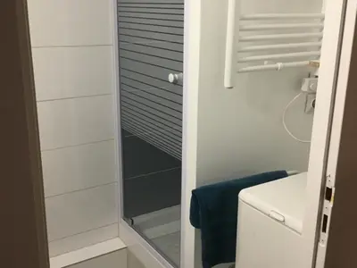 a shower with a glass door in a bathroom at Studio cosy pour 4 à Samoëns - FR-1-846-4 in Samoëns