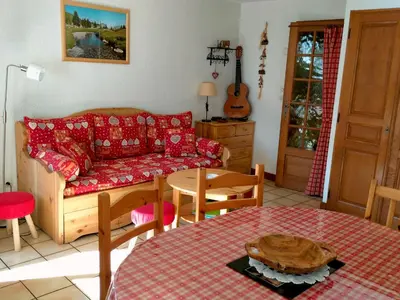 a living room with a couch and a table at Appartement cosy 2 pièces avec Wifi à Samoëns - FR-1-846-10 in Samoëns
