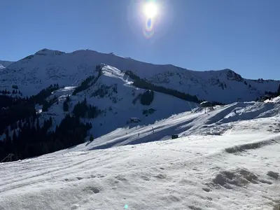 a snow covered mountain with the sun in the sky at Studio confortable à Samoëns 1600 pour 4 personnes - FR-1-846-3 in Samoëns