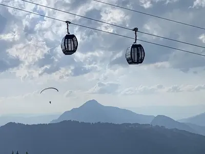two chairs on a wire with mountains in the background at Studio confortable à Samoëns 1600 pour 4 personnes - FR-1-846-3 in Samoëns