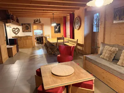a living room with a couch and a table at Grand chalet à Samoëns pour 11 personnes avec Wifi - FR-1-846-7 in Samoëns