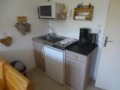 a small kitchen with a sink and a microwave at Studio cosy pour 4 à Samoëns - FR-1-846-22 in Samoëns