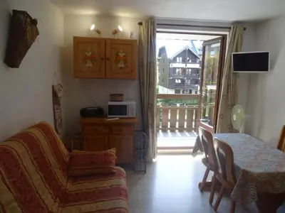 a living room with a couch and a table and a window at Studio cosy pour 4 à Samoëns - FR-1-846-22 in Samoëns