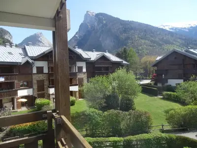 a view from the balcony of a resort with a mountain at Studio cosy pour 4 à Samoëns - FR-1-846-22 in Samoëns