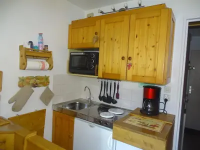 a small kitchen with a sink and a microwave at Studio confortable pour 4 personnes à Samoëns - FR-1-846-17 in Samoëns