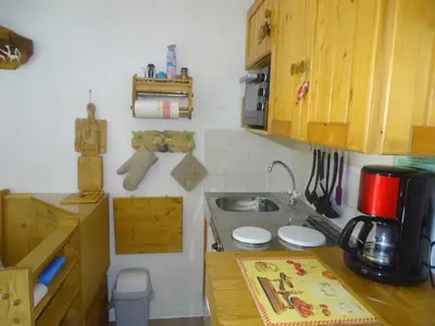 a small kitchen with a sink and a counter at Studio confortable pour 4 personnes à Samoëns - FR-1-846-17 in Samoëns