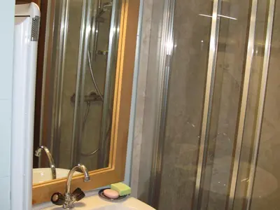 a bathroom with a shower and a sink with a sink at Appartement à Samoëns avec Wifi, idéal pour 3 pers. - FR-1-846-23 in Samoëns