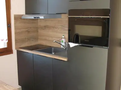 a kitchen with a sink and a microwave at Appartement à Samoëns avec Wifi, idéal pour 3 pers. - FR-1-846-23 in Samoëns