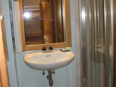 a white sink in a bathroom with a mirror at Appartement à Samoëns avec Wifi, idéal pour 3 pers. - FR-1-846-23 in Samoëns