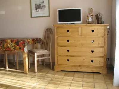 a wooden dresser with a television on top of it at Appartement à Samoëns avec Wifi, idéal pour 3 pers. - FR-1-846-23 in Samoëns