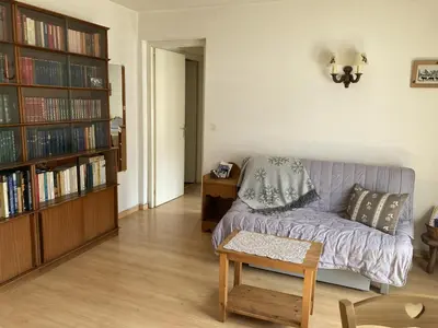 a bedroom with a bed and a bench with towels at Appartement cosy pour 2 avec Wifi à Samoëns - FR-1-846-27 in Samoëns