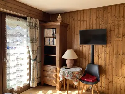 a park with a bench in the middle of a lake at Appartement cosy pour 2 avec Wifi à Samoëns - FR-1-846-27 in Samoëns