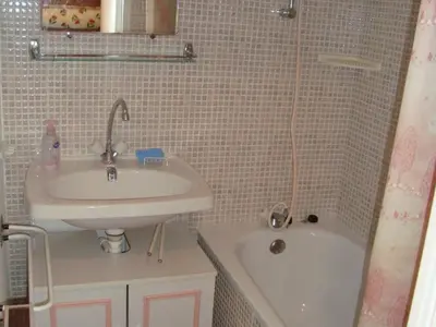 a small bathroom with a sink and a bath tub at Studio cosy pour 4 personnes à Samoëns - FR-1-846-31 in Samoëns