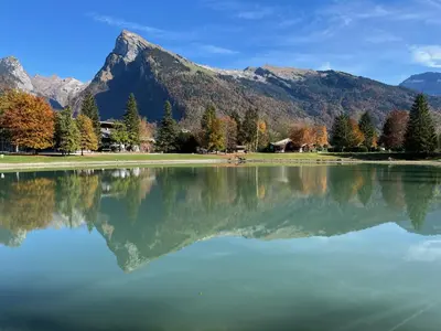 a view of a lake with mountains in the background at Appartement spacieux à Samoëns - 8 personnes avec Wifi - FR-1-846-38 in Samoëns